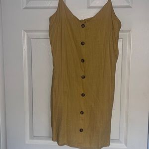 Yellow summer dress with bow on the back. On the shorter side.